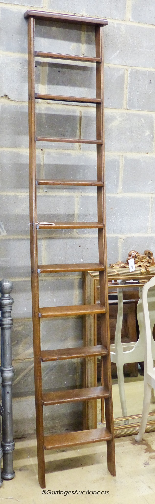 A Victorian oak 10 tread library ladder. W-38, H-229cm.